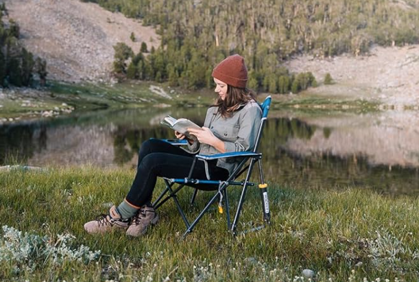 GCI budget camping chair. lady outside